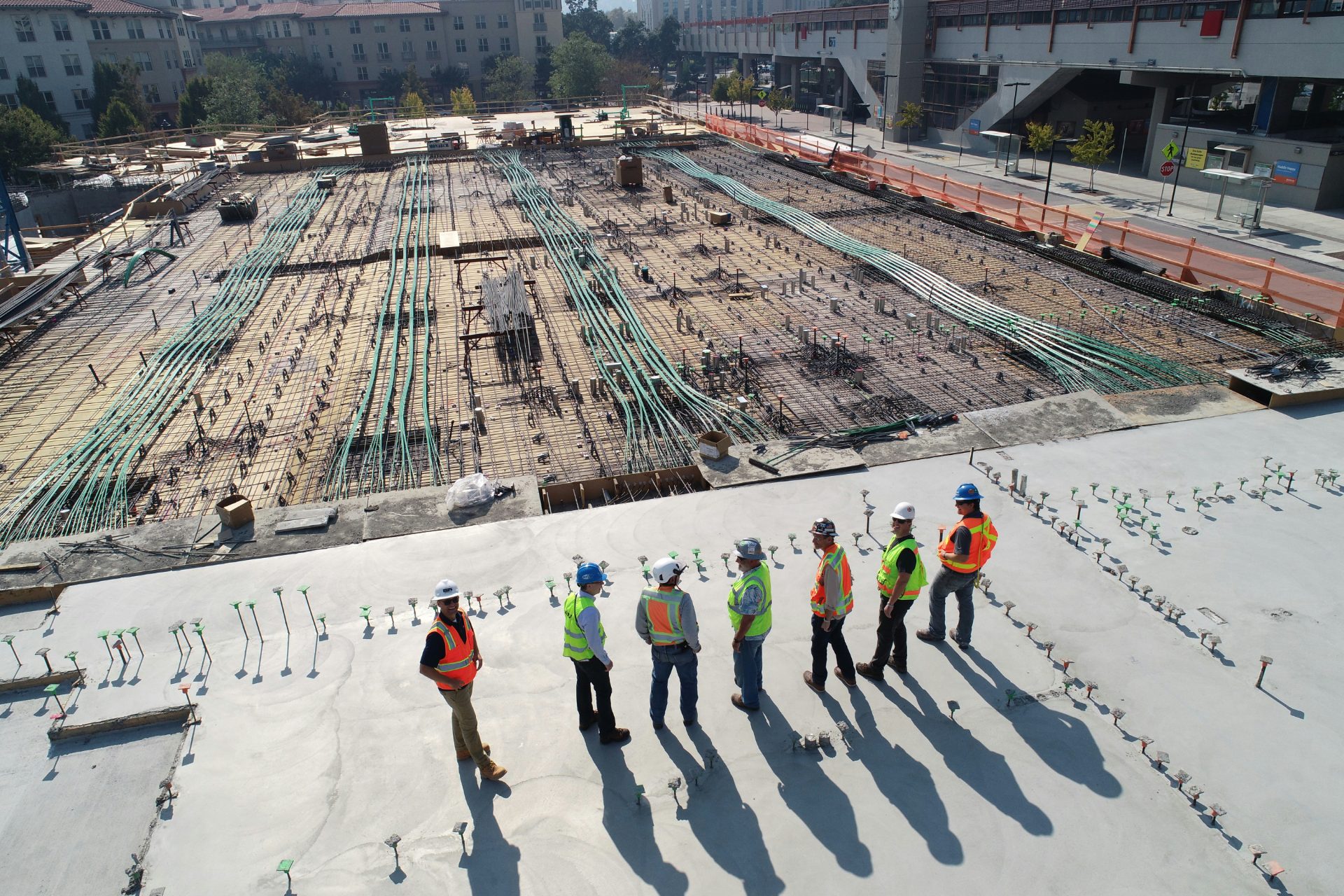 Construction leadership team walking a project site